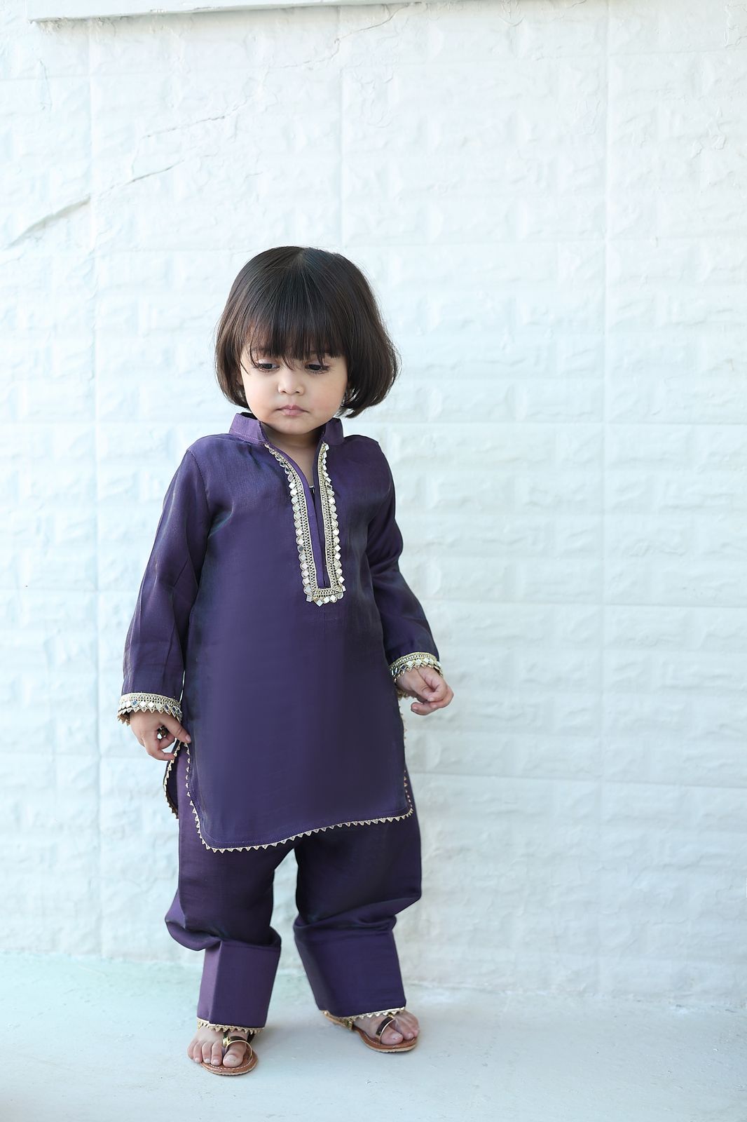 Baby girl wearing Hoor deep purple festive kurta set