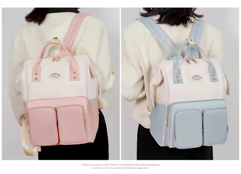 Mom carrying MotherCare Elite diaper backpack for everyday use